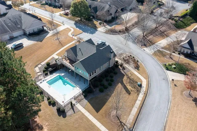 an aerial view of a house with garden space and street view
