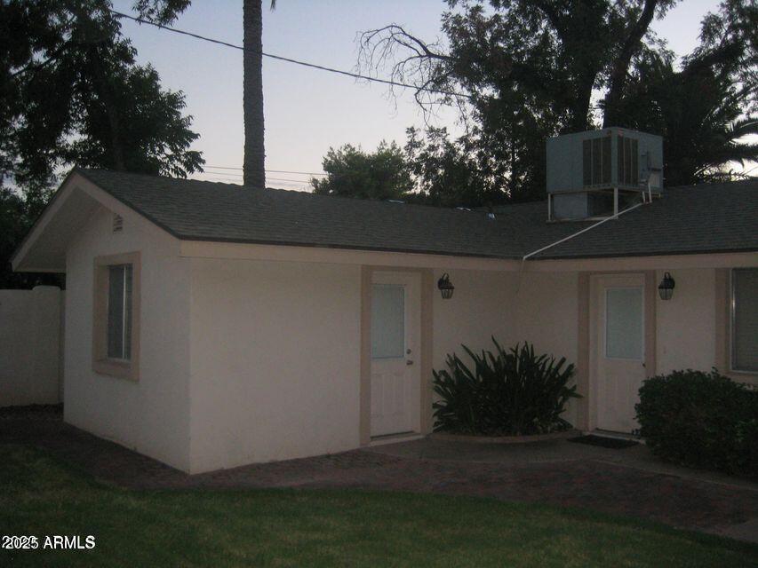1224 South Maple Avenue Tempe, AZ 85281 - Photo 25 of 31 a view of backyard with potted plants and a tree