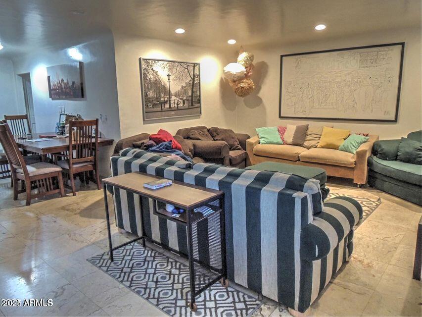 1224 South Maple Avenue Tempe, AZ 85281 - Photo 8 of 31 a living room with furniture and a flat screen tv