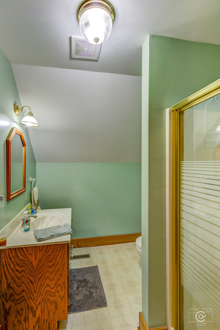 4670 Rich Road DeKalb, IL 60115 - Photo 17 of 24 a bathroom with a sink and a mirror