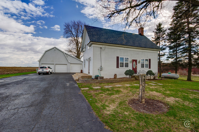 4670 Rich Road DeKalb, IL 60115 - Photo 23 of 24 a view of a house with backyard and a tree