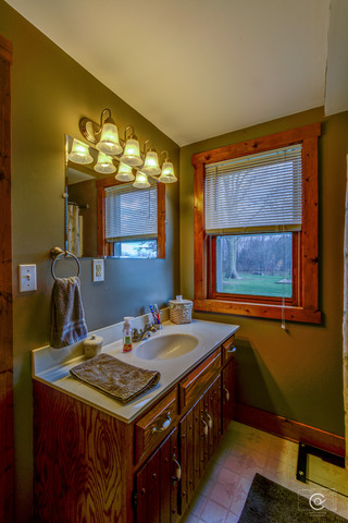 4670 Rich Road DeKalb, IL 60115 - Photo 7 of 24 a kitchen with a stove a sink and a refrigerator