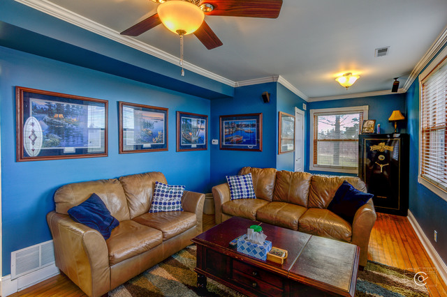 4670 Rich Road DeKalb, IL 60115 - Photo 9 of 24 a blue living room with a couch and a coffee table