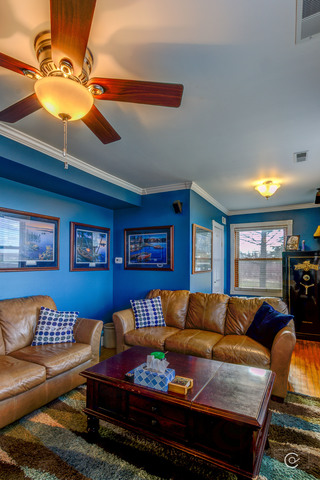 4670 Rich Road DeKalb, IL 60115 - Photo 10 of 24 a living room with furniture a ceiling fan and a lamp