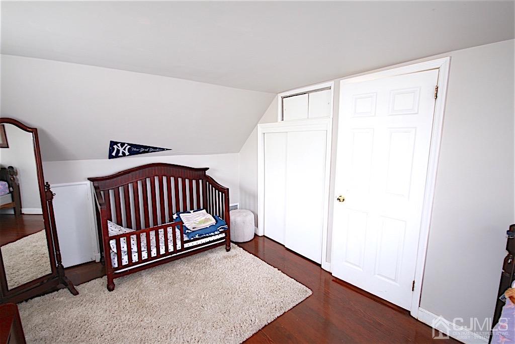 177 Midfield Road Colonia, NJ 07067 - Photo 12 of 20 a view of a room with wooden floor and windows
