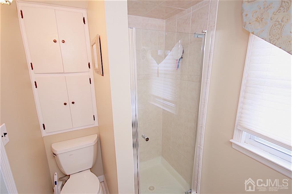 177 Midfield Road Colonia, NJ 07067 - Photo 14 of 20 a bathroom with a toilet and a shower