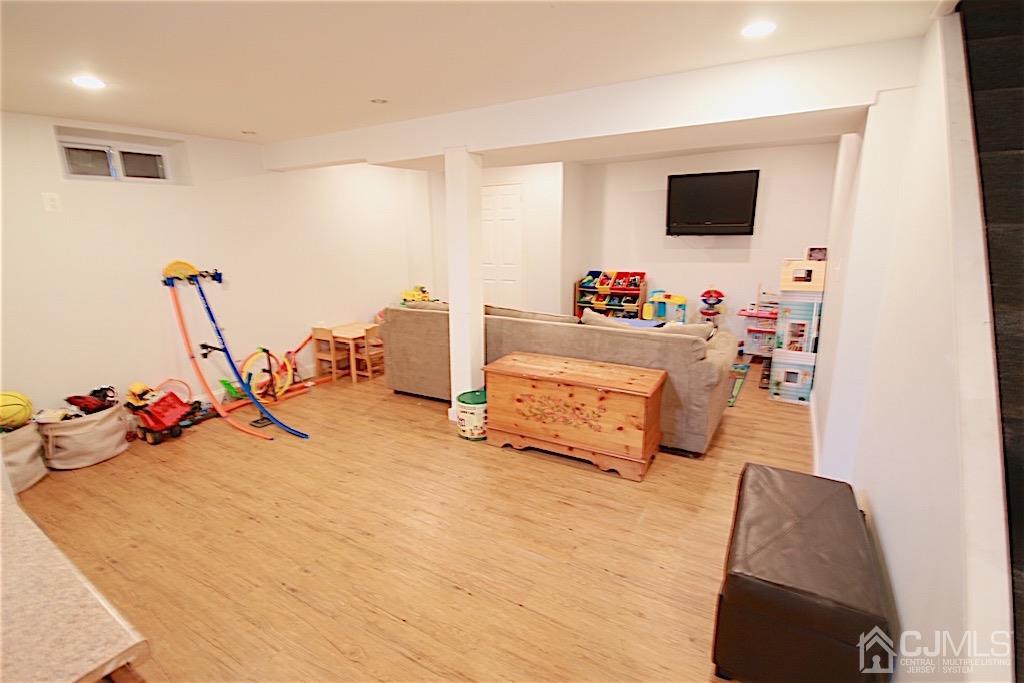 177 Midfield Road Colonia, NJ 07067 - Photo 15 of 20 a bedroom with furniture and a flat screen tv