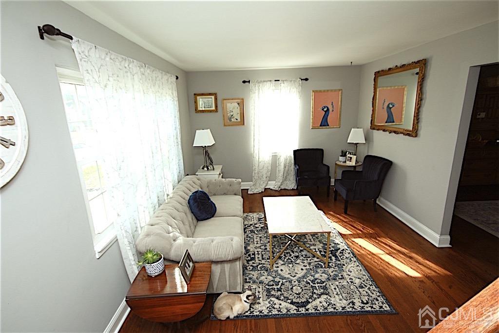 177 Midfield Road Colonia, NJ 07067 - Photo 5 of 20 a living room with furniture and a rug
