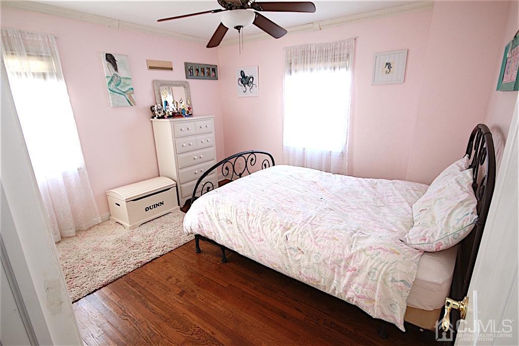 177 Midfield Road Colonia, NJ 07067 - Photo 8 of 20 a bedroom with a bed dresser and a window