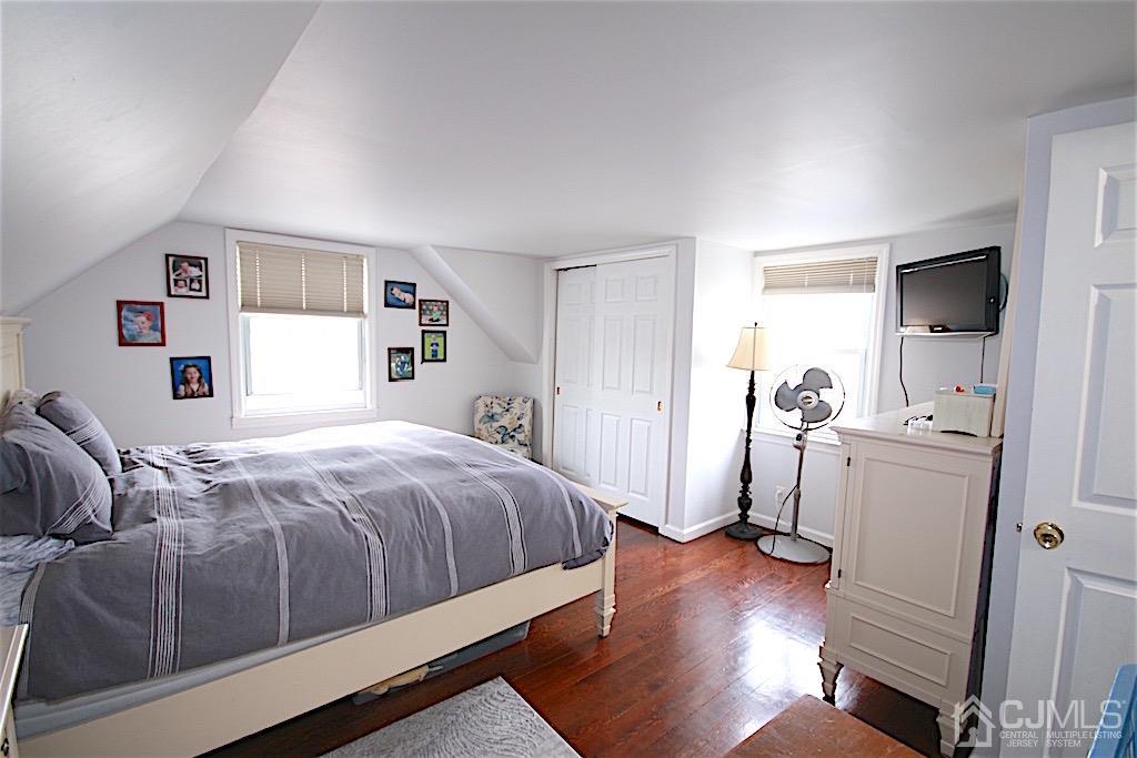 177 Midfield Road Colonia, NJ 07067 - Photo 10 of 20 a bedroom with a bed and a flat tv screen on the dresser