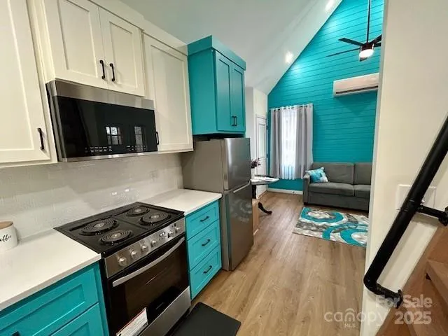 a kitchen with wooden cabinets and a stove top oven