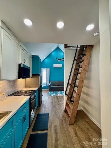 a kitchen with sink and cabinets