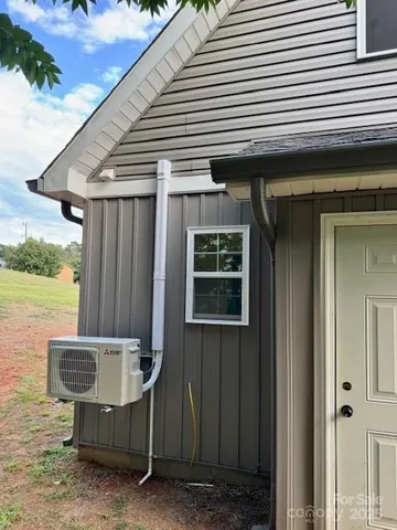 a view of backyard with cabin