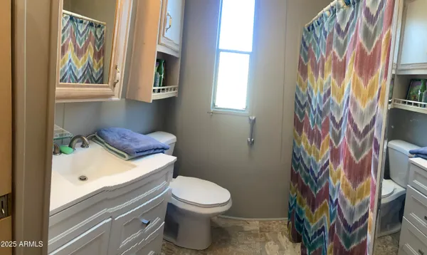 a bathroom with a toilet and a sink