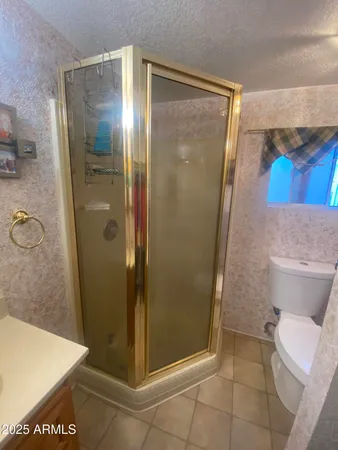 a bathroom with a glass door shower