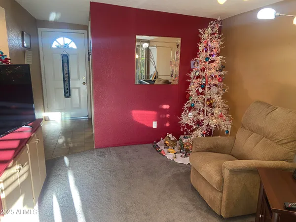 a living room with a christmas tree