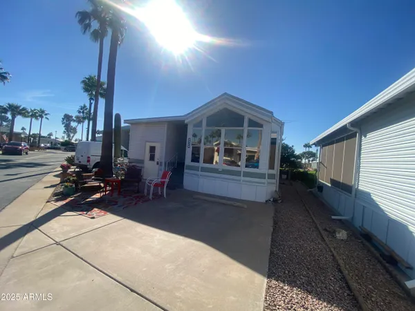 a view of a patio with table and chairs a barbeque with wooden fence