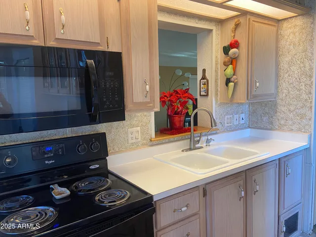 a kitchen with a stove and a sink