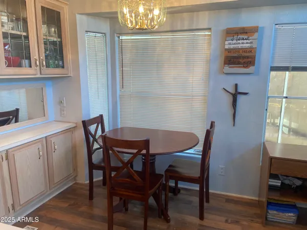 a view of a dining room with furniture and wooden floor