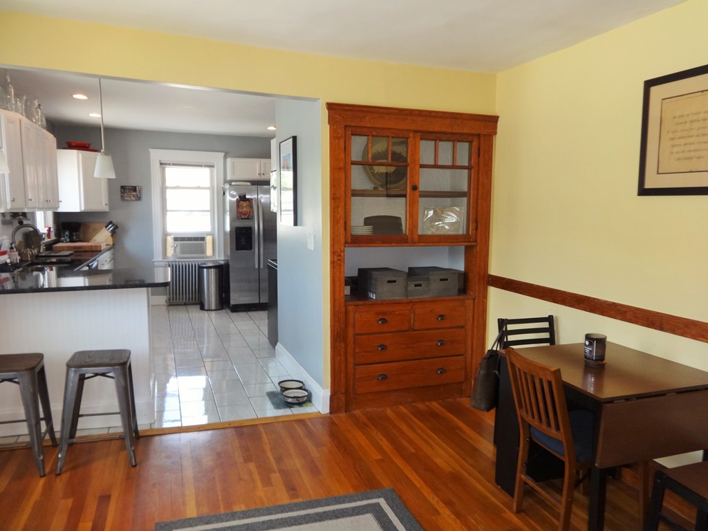 37 Everett Street, Unit 3 Waltham, MA 02453 - Photo 13 of 16 a bedroom with furniture and wooden floor