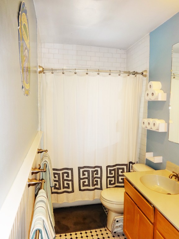 37 Everett Street, Unit 3 Waltham, MA 02453 - Photo 14 of 16 a bathroom with a sink and a mirror