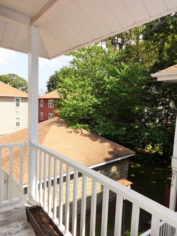 37 Everett Street, Unit 3 Waltham, MA 02453 - Photo 15 of 16 a view of a balcony with chair and table