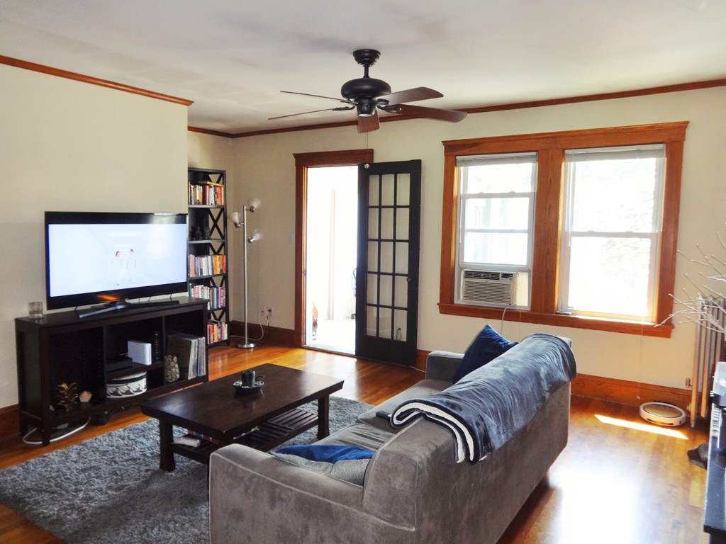 37 Everett Street, Unit 3 Waltham, MA 02453 - Photo 3 of 16 a living room with furniture and a flat screen tv