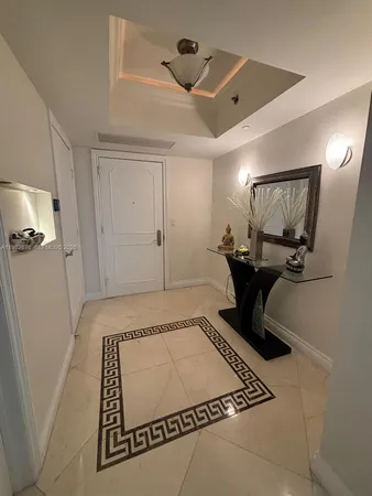 a view of a hallway with staircase