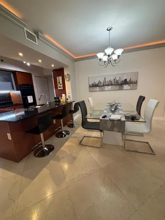 a view of a livingroom with workspace and a couch