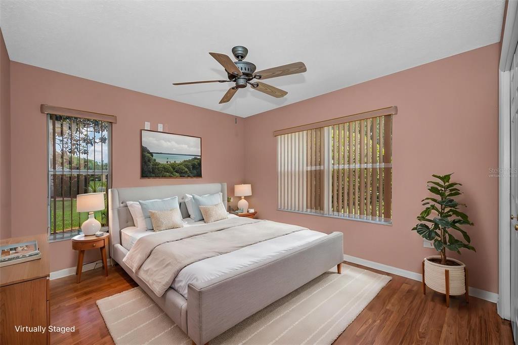 11917 Hadleigh Way Trinity, FL 34655 - Photo 36 of 84 a bedroom with a large bed and a window