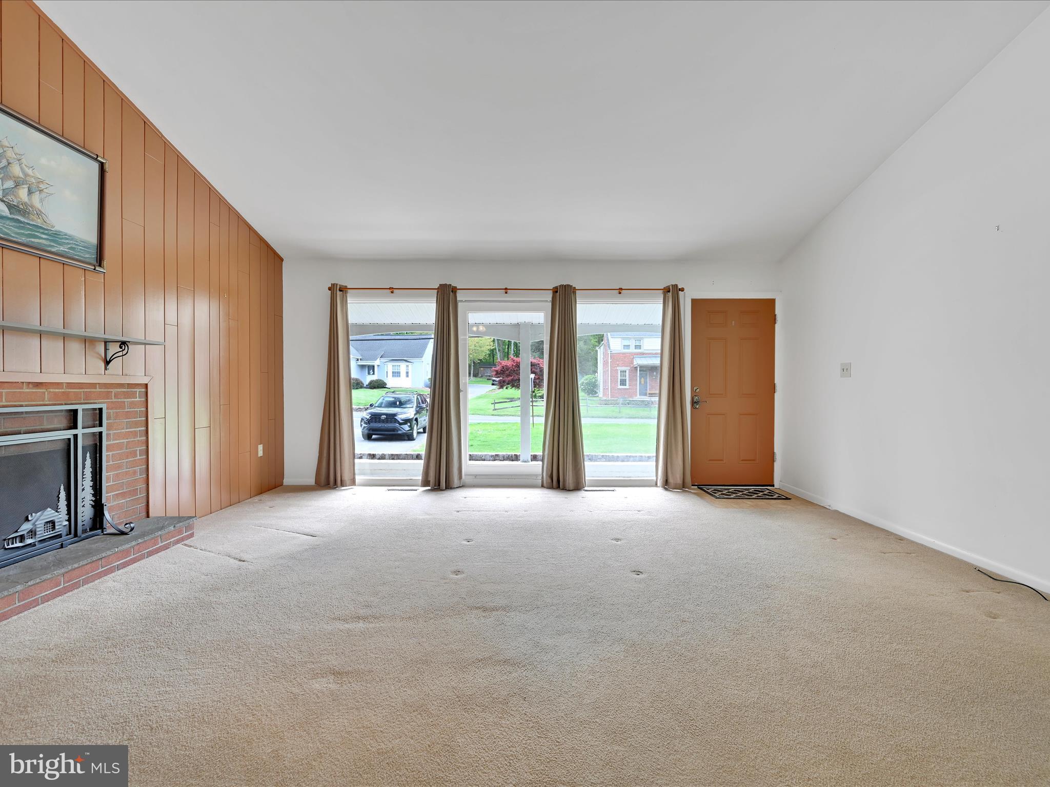 601 Valley Road Lancaster, PA 17601 - Photo 7 of 33 a view of an empty room with a fireplace and a window