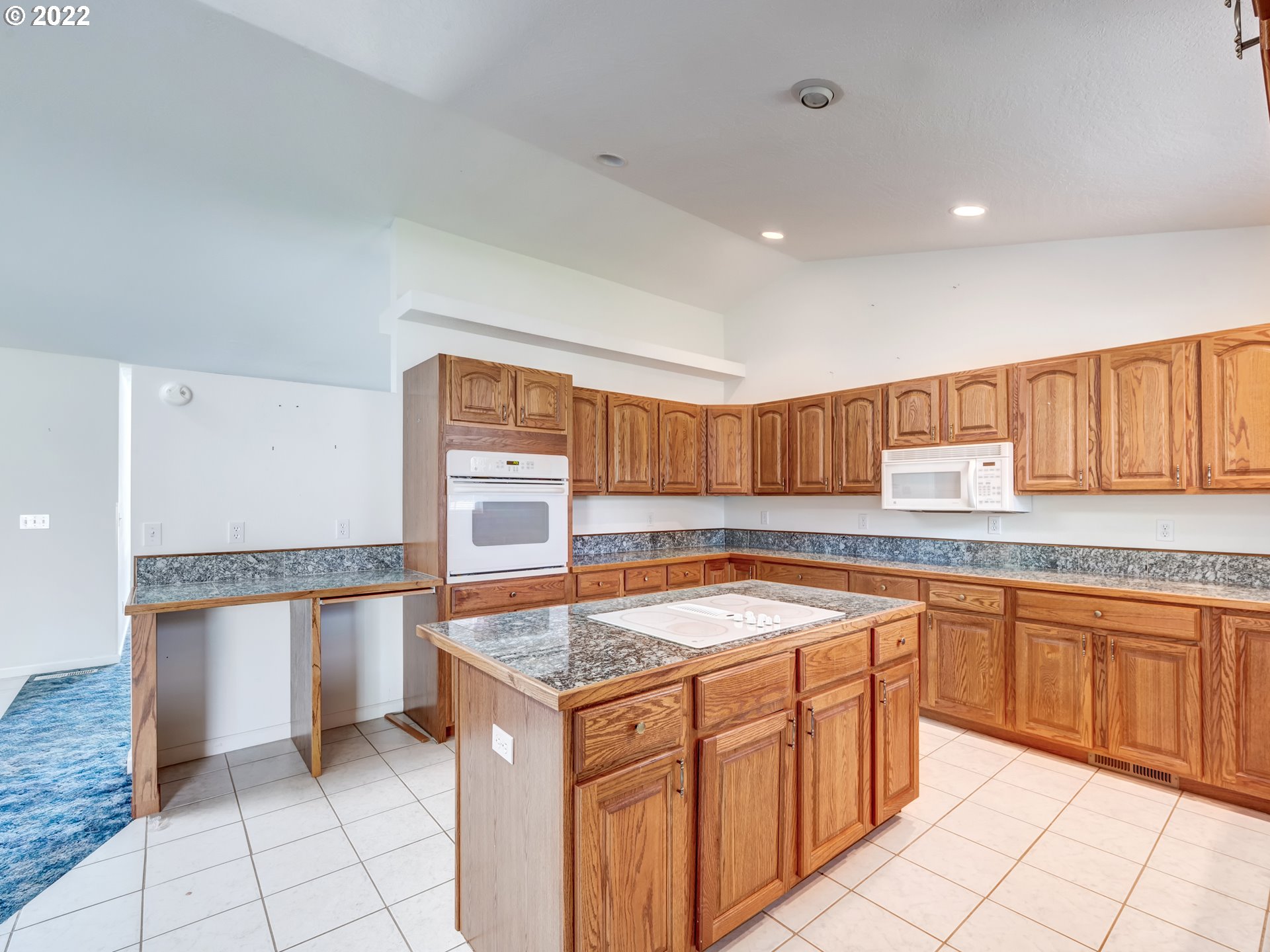 924 S Street Springfield, OR 97477 - Photo 12 of 30 a kitchen with granite countertop a sink and white cabinets
