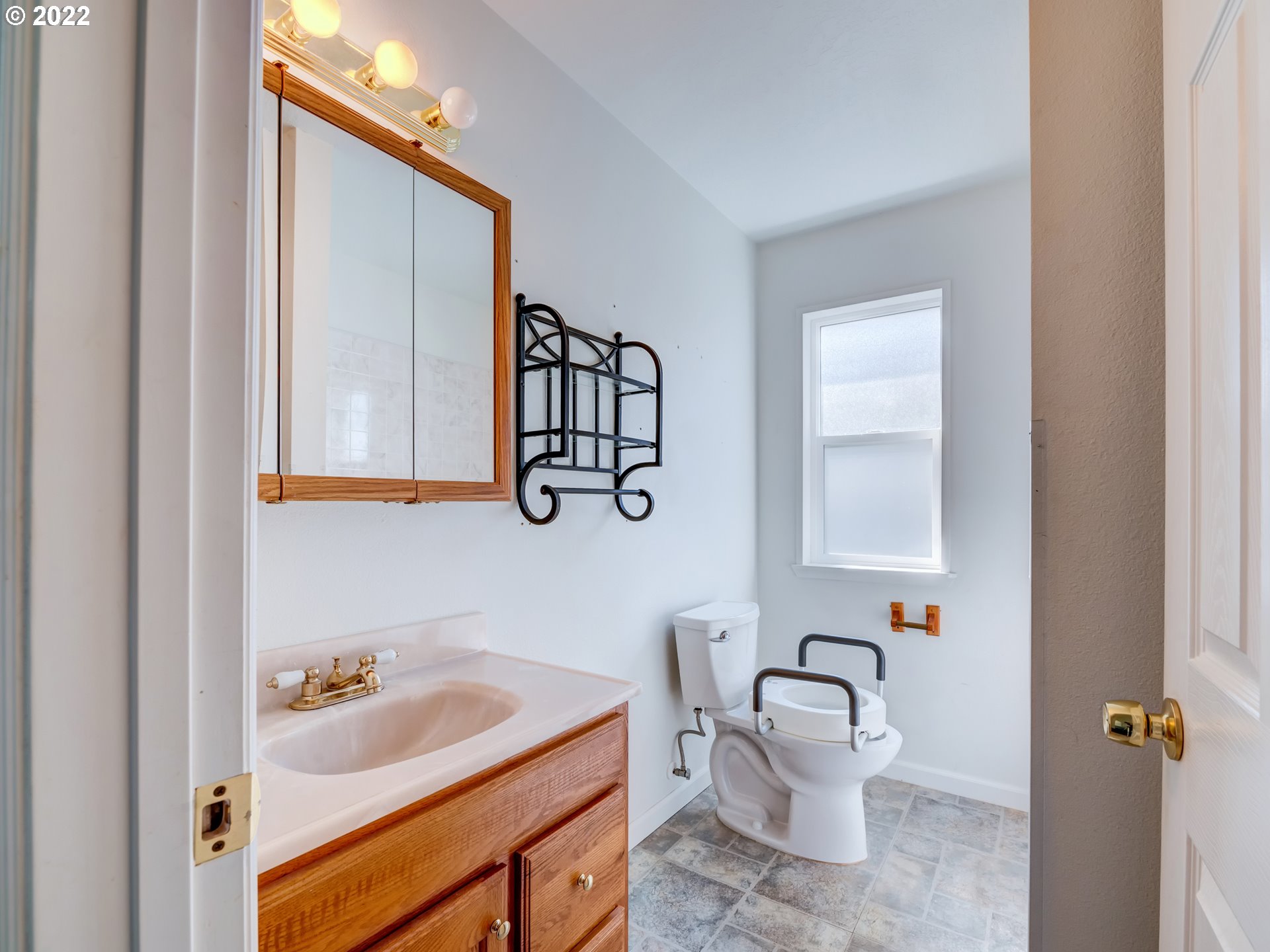 924 S Street Springfield, OR 97477 - Photo 18 of 30 a bathroom with a sink and a mirror