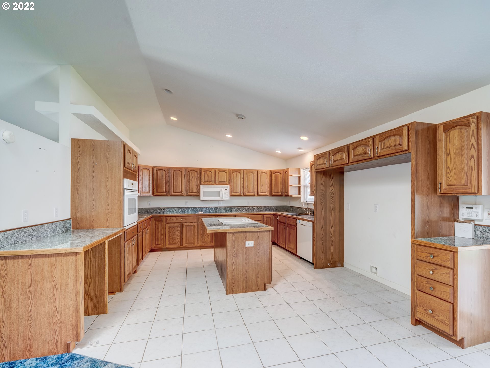 924 S Street Springfield, OR 97477 - Photo 9 of 30 a kitchen with a refrigerator and wooden cabinets