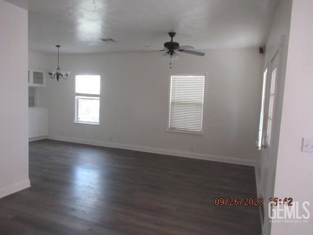Undisclosed Address Taft, CA 93268 - Photo 13 of 28 an empty room with wooden floor and windows