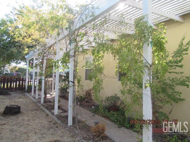 Undisclosed Address Taft, CA 93268 - Photo 21 of 28 a backyard of a house with lots of green space