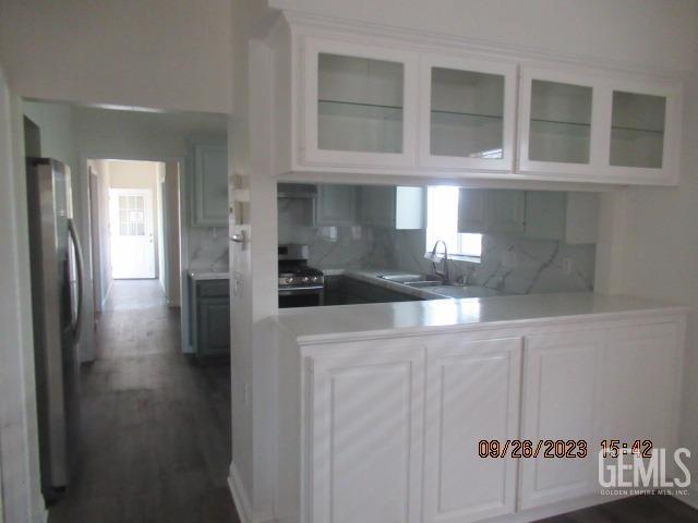 Undisclosed Address Taft, CA 93268 - Photo 10 of 28 a kitchen with a refrigerator and cabinets