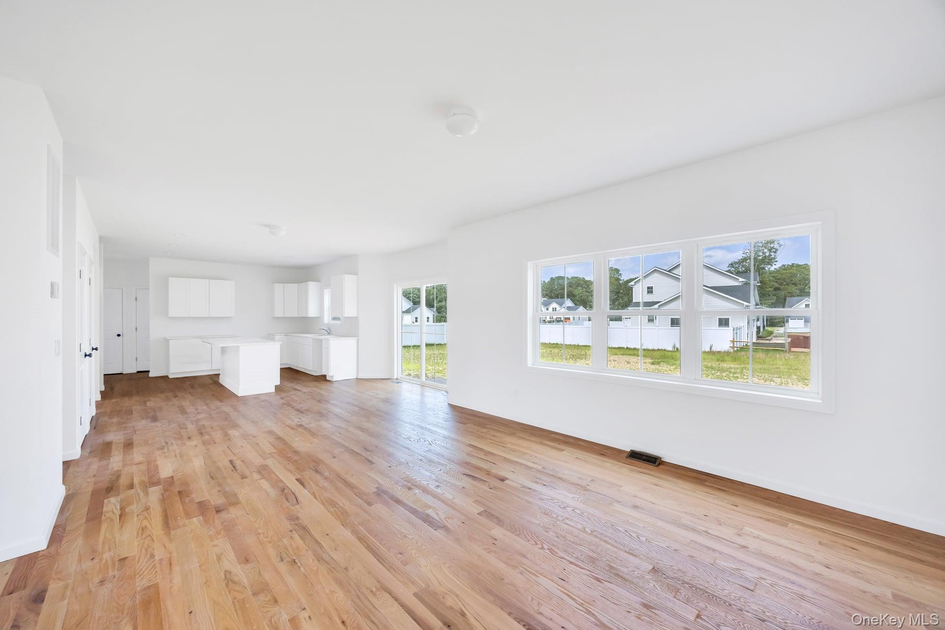 Lot #4 Cardinal Court Ridge, NY 11961 - Photo 23 of 48 a view of empty room with wooden floor and window