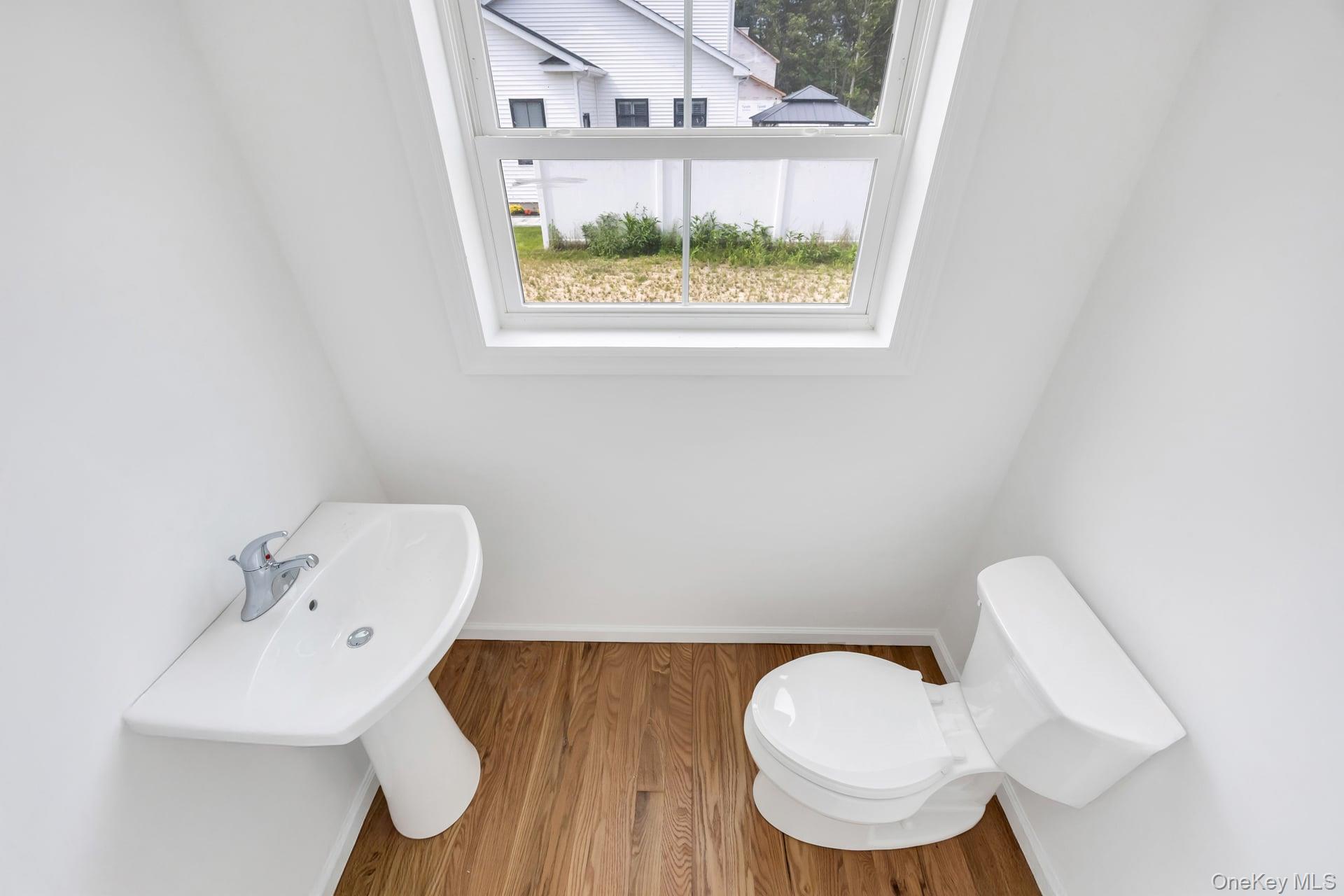 Lot #4 Cardinal Court Ridge, NY 11961 - Photo 30 of 48 a bathroom with a toilet a sink and a window