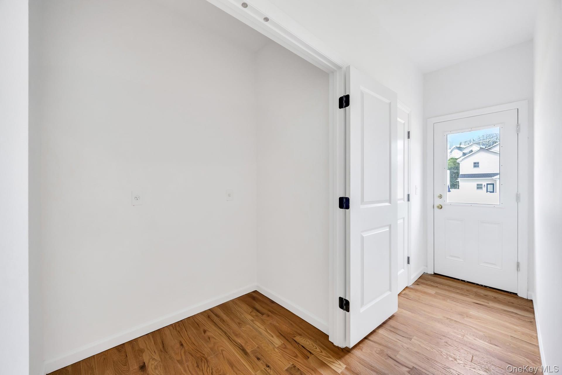 Lot #4 Cardinal Court Ridge, NY 11961 - Photo 31 of 48 a view of a hallway with wooden floor and closet area