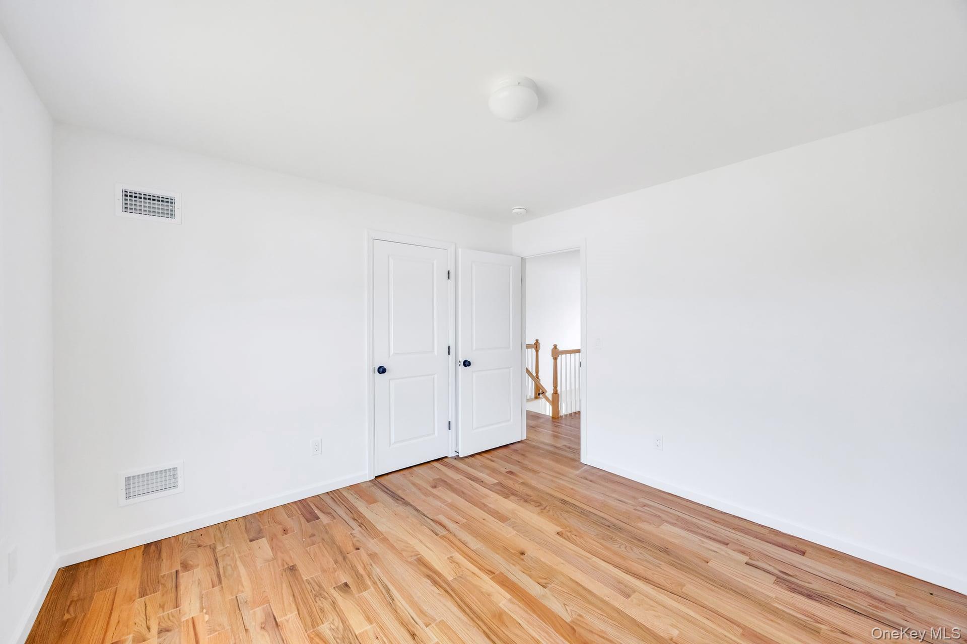 Lot #4 Cardinal Court Ridge, NY 11961 - Photo 33 of 48 a view of empty room with wooden floor