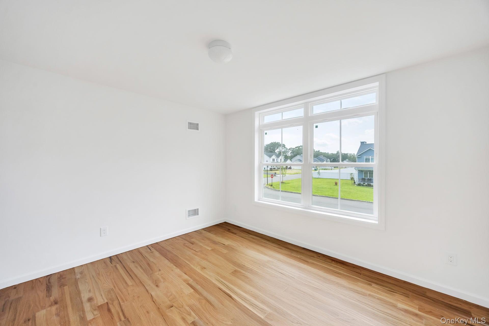 Lot #4 Cardinal Court Ridge, NY 11961 - Photo 36 of 48 an empty room with a window