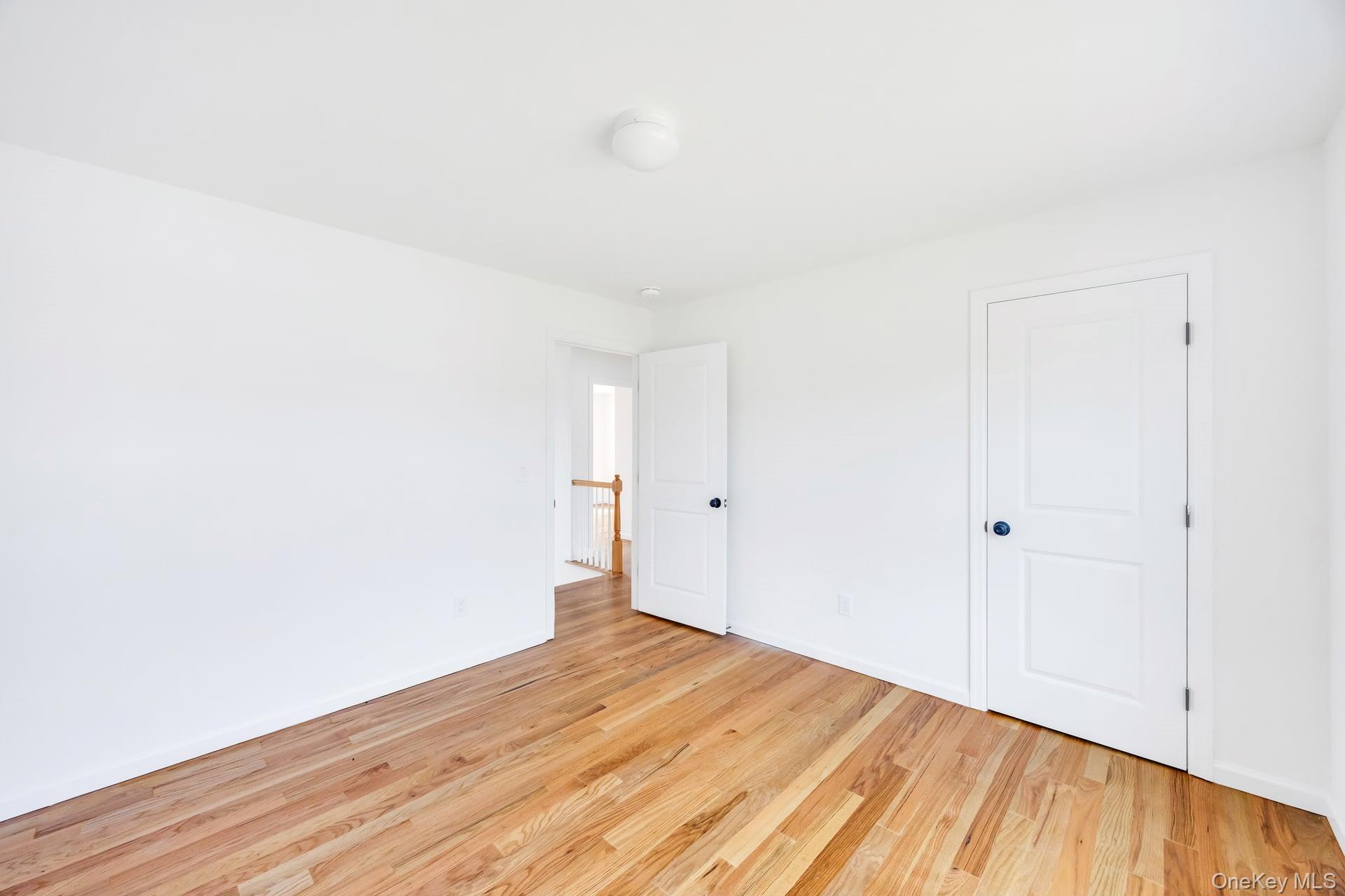 Lot #4 Cardinal Court Ridge, NY 11961 - Photo 39 of 48 a view of a room with wooden floor