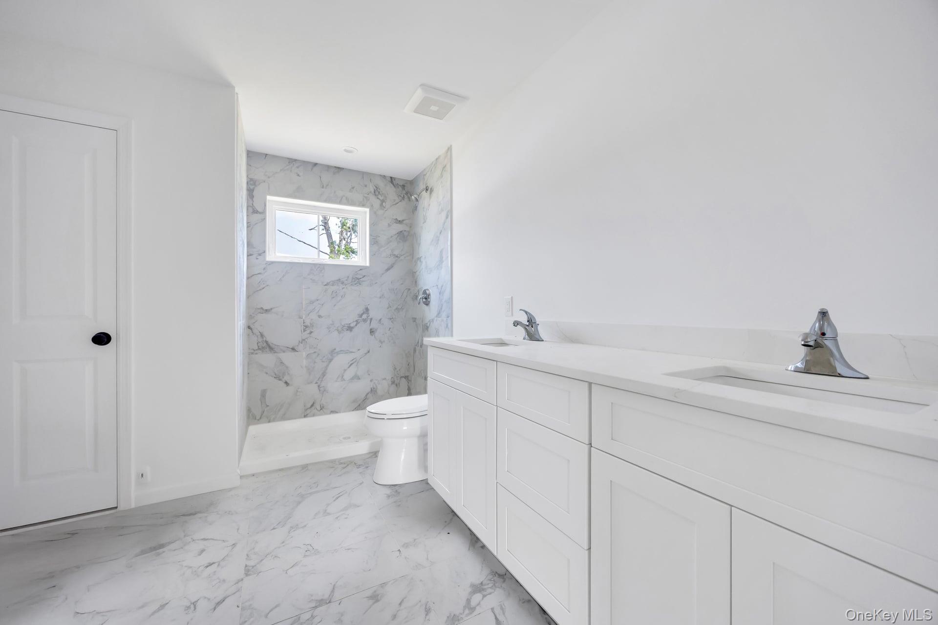 Lot #4 Cardinal Court Ridge, NY 11961 - Photo 42 of 48 a spacious bathroom with a toilet sink and shower