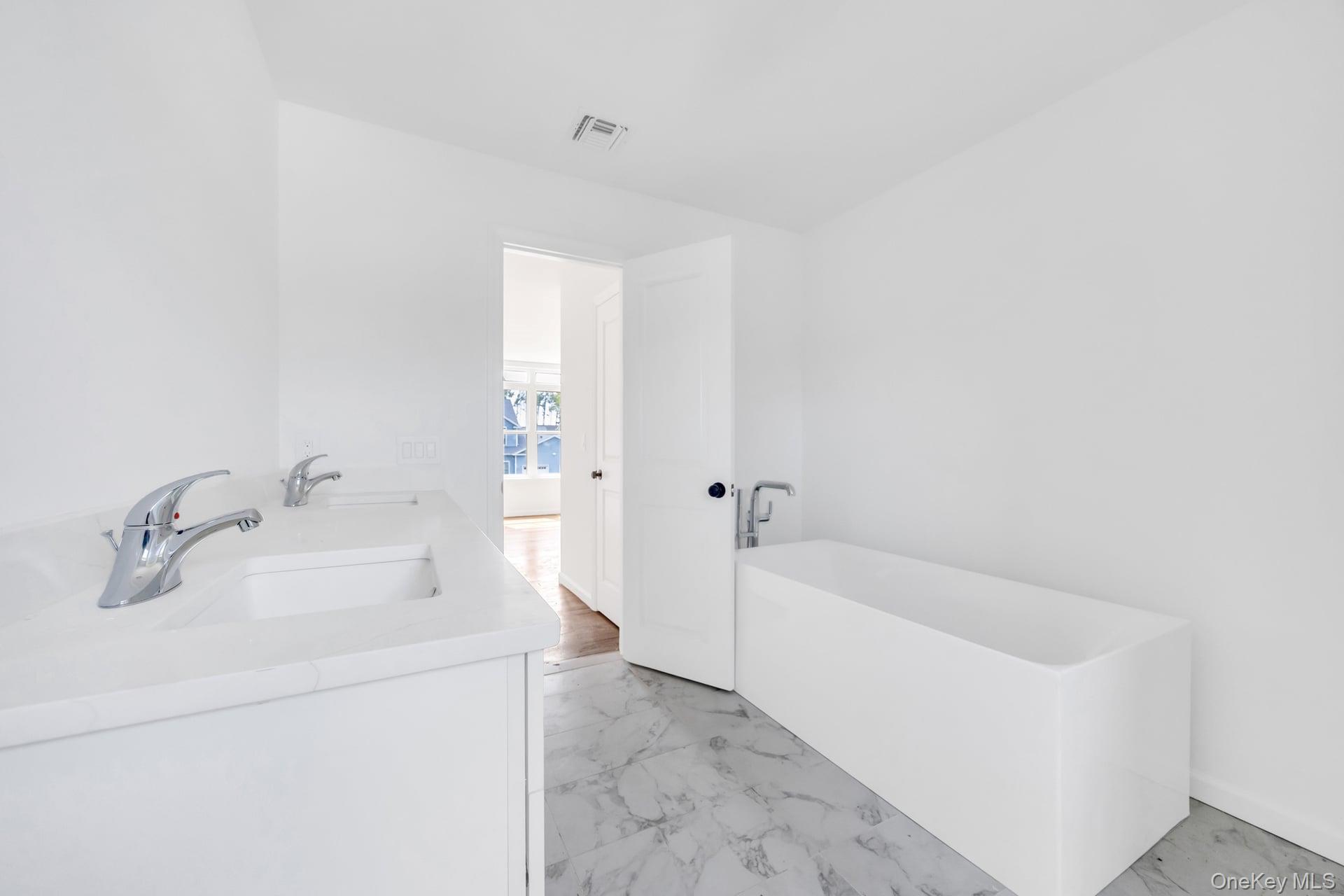 Lot #4 Cardinal Court Ridge, NY 11961 - Photo 43 of 48 a bathroom with a bathtub and sink