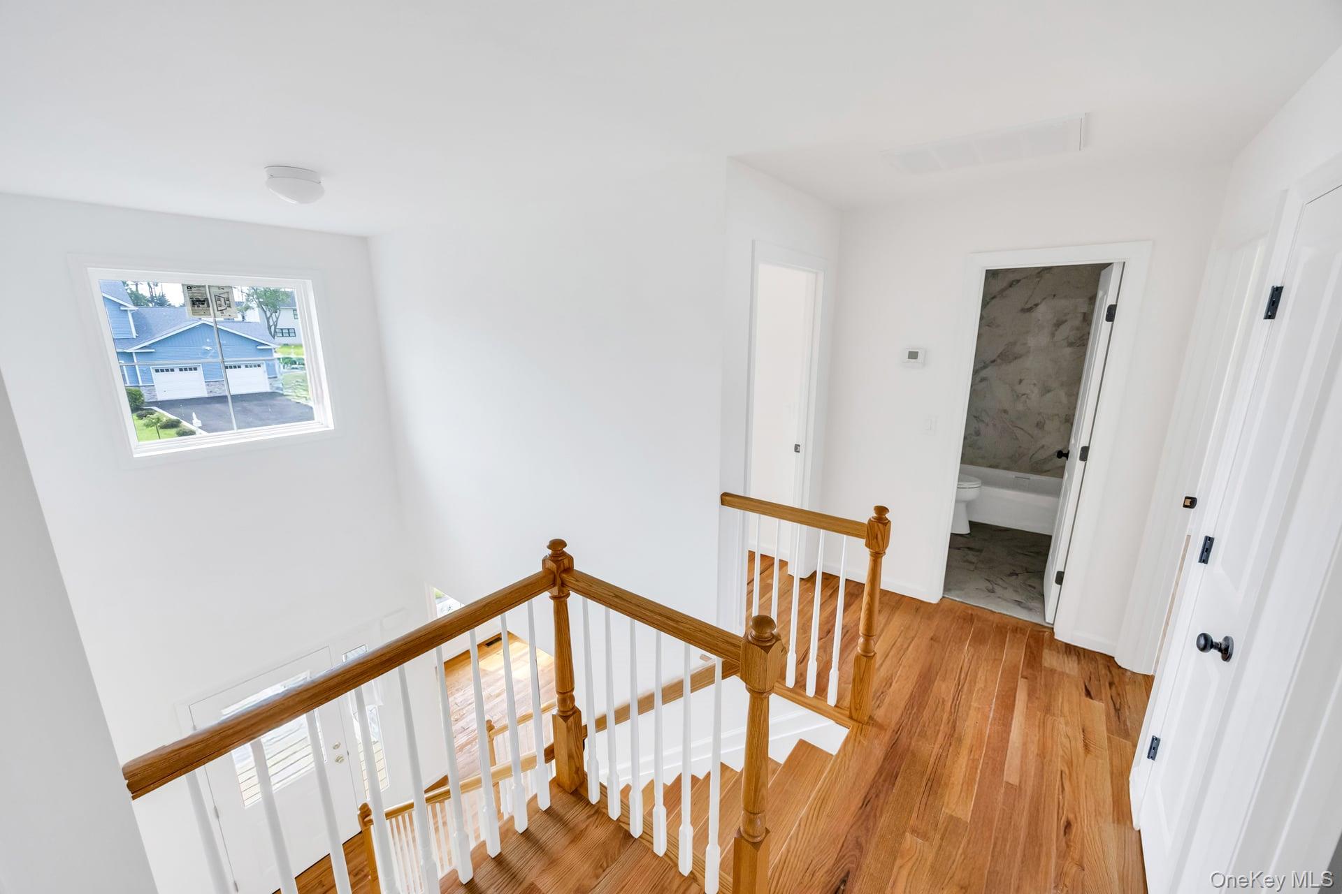 Lot #4 Cardinal Court Ridge, NY 11961 - Photo 45 of 48 a view of an entryway with wooden floor