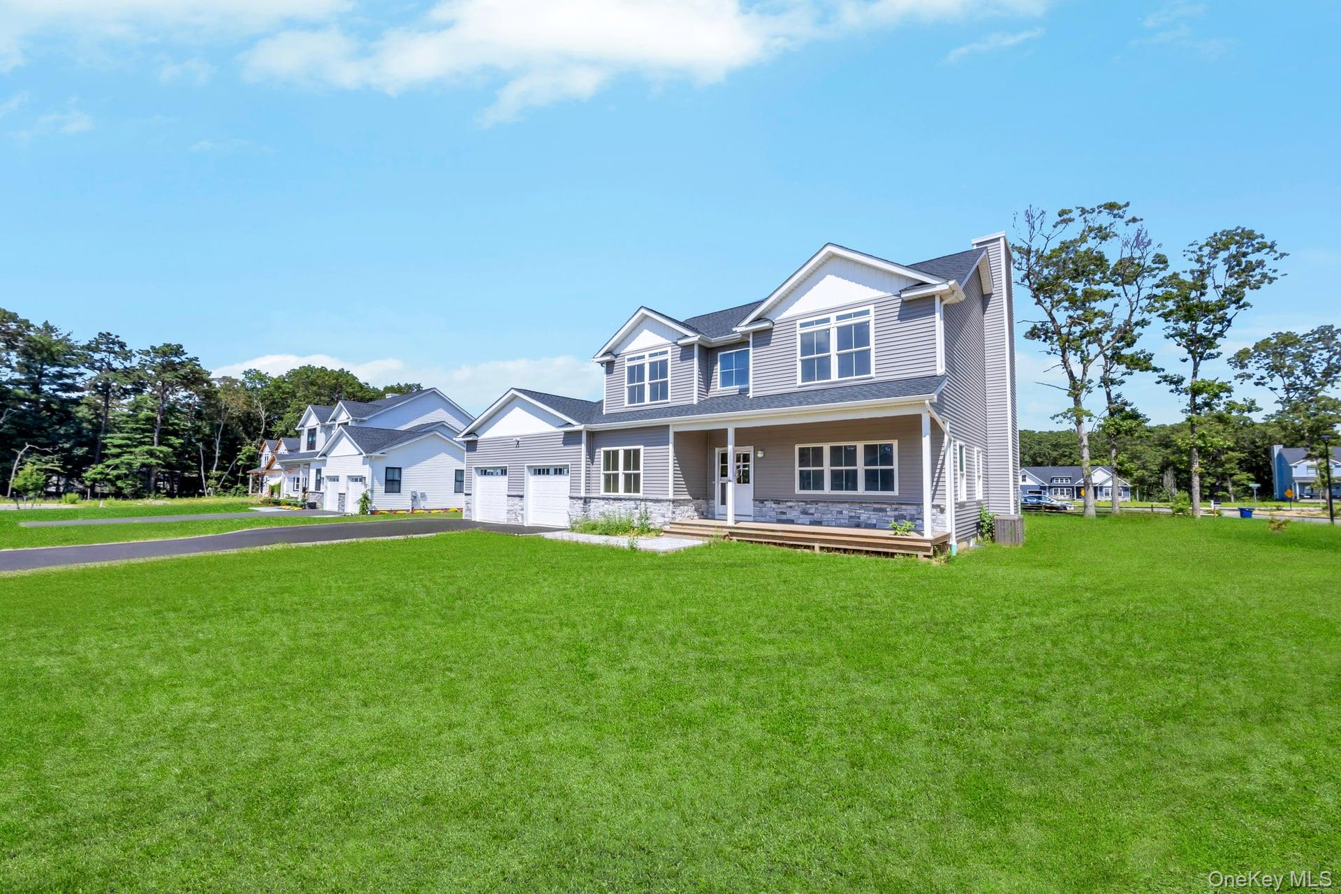 Lot #4 Cardinal Court Ridge, NY 11961 - Photo 48 of 48 a front view of house with yard and green space