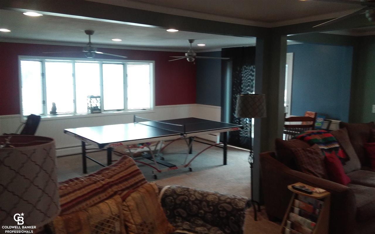 5325 Russell Road Palms, MI 48465 - Photo 31 of 53 View of the living room and formal dining area from the staircase