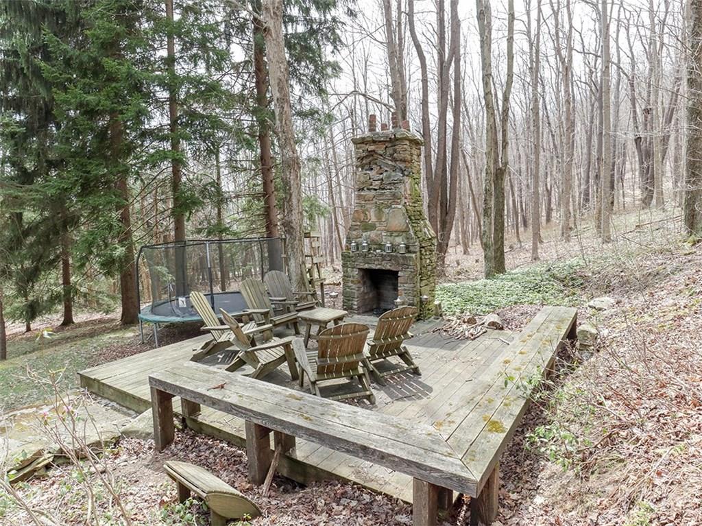 2534 County Line Road Champion, PA 15622 - Photo 22 of 24 You can relax by the fire indoors or outside! The deck area creates a sitting area for hot dogs and s'mores!