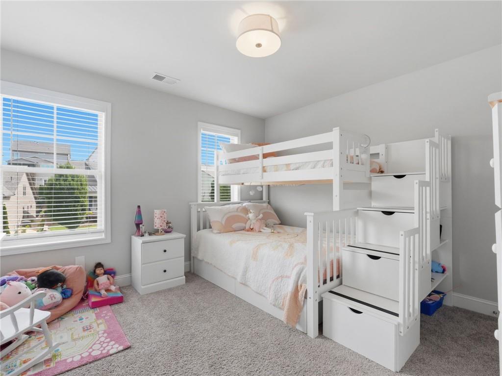 147 Fieldbrook Crossing Canton, GA 30115 - Photo 28 of 46 a bedroom with a bed and a window